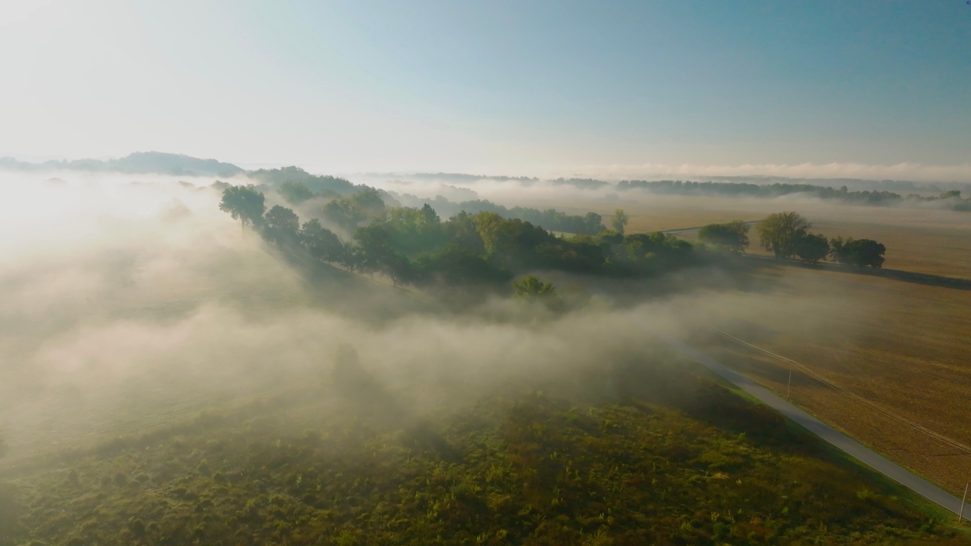 Morning fog lying across fields and treelines in the Missouri River valley